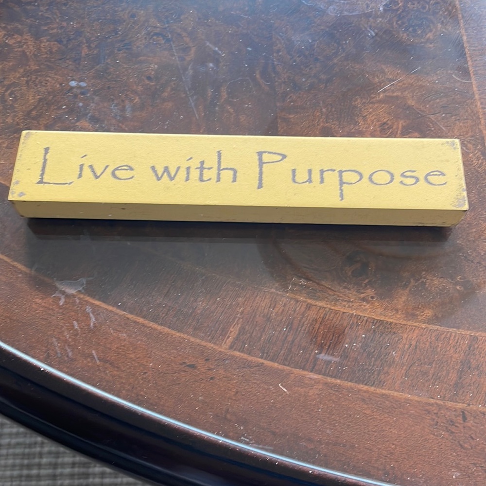 Yellow sign that says Live with purpose